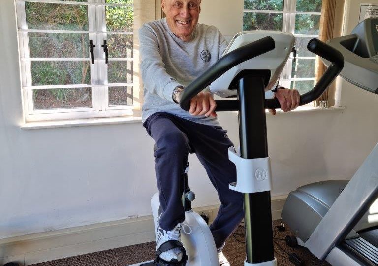 Barry-Black-trying-out-our-new-exercise-bike
